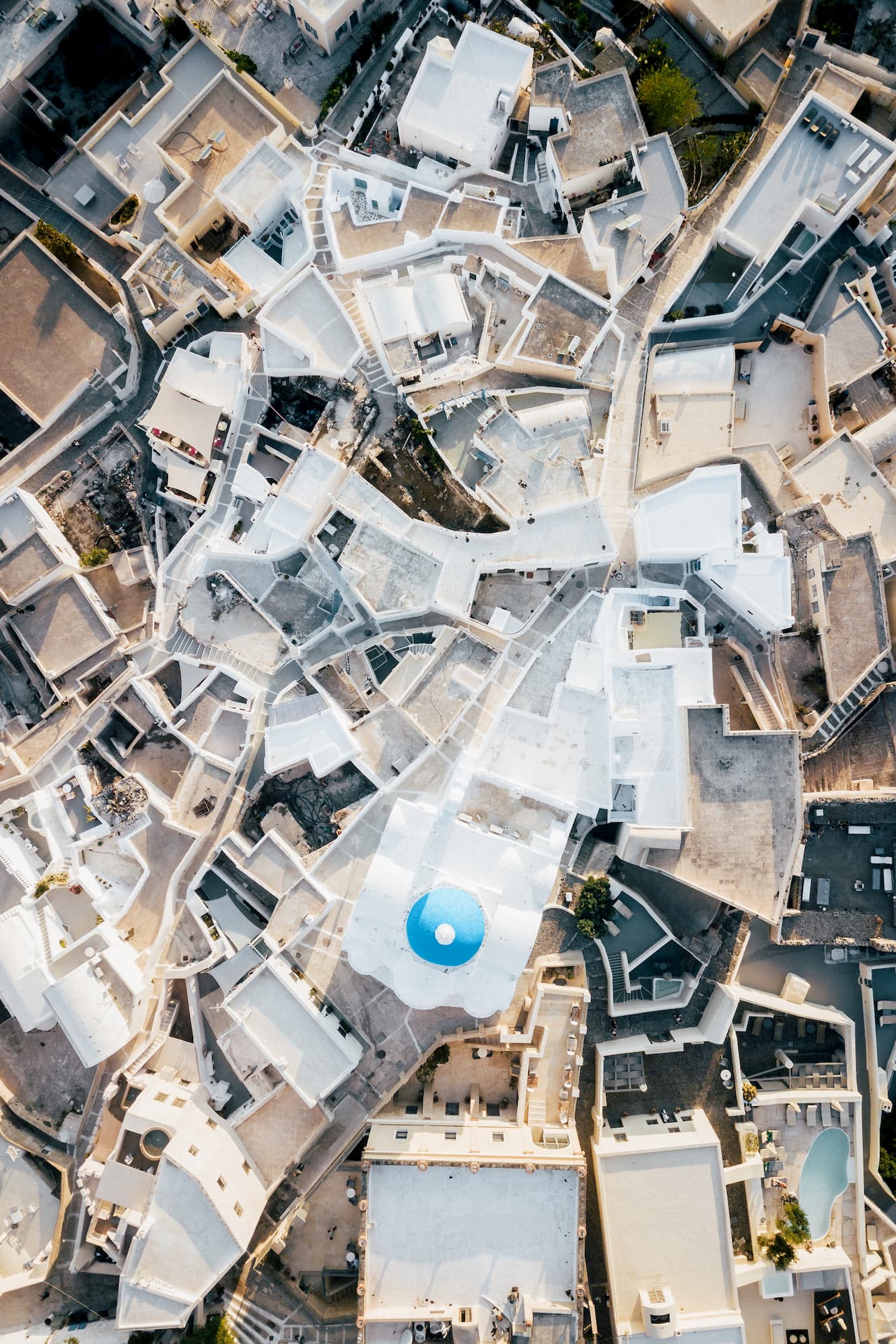 A panoramic view of white and blue roofs on a Greek island.